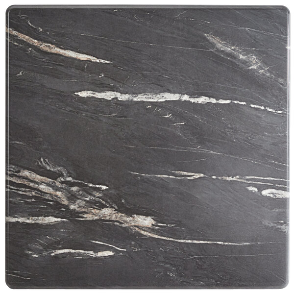 A black and white marble surface on a Lancaster Table & Seating square dining table.