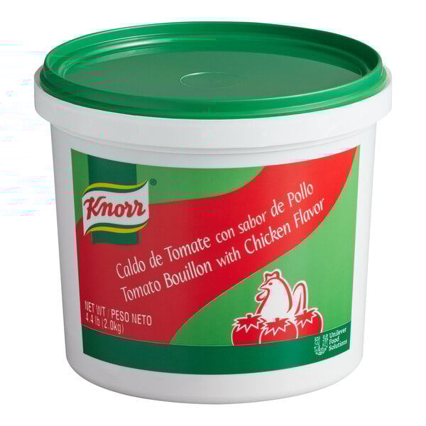 A white container of Knorr Caldo de Tomate con sabor de Pollo with a green lid.