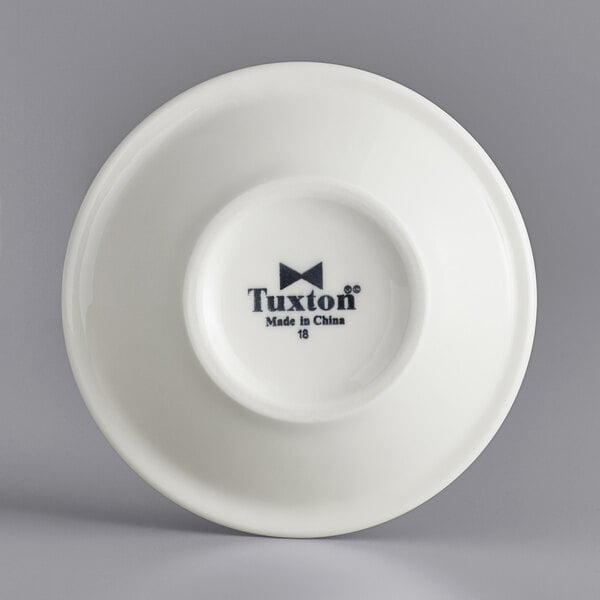 A white Tuxton china fruit dish with black text reading "Tuxton Reno Nevada" and a logo.