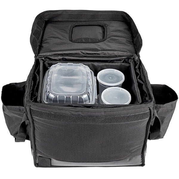 A black Vesture heavy-duty insulated catering bag with plastic containers inside.