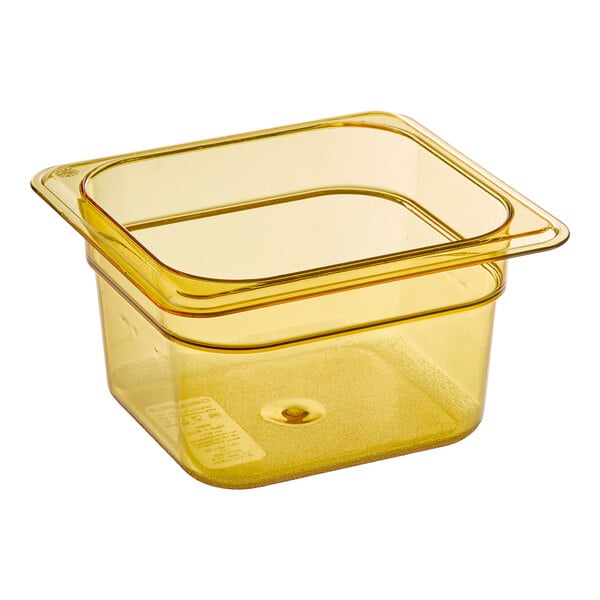 A yellow Carlisle plastic food pan with a lid.