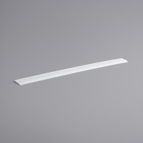 A white rectangular object on a gray background.