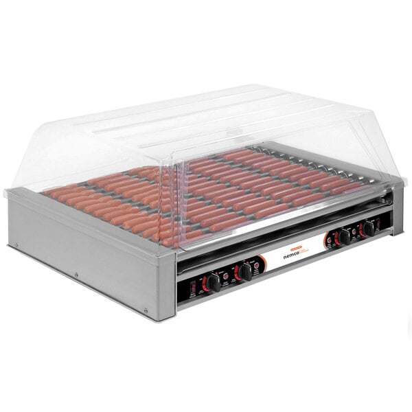 A Nemco hot dog grill with hot dogs cooking.