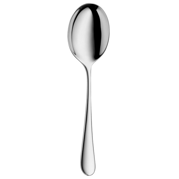 A WMF stainless steel vegetable serving spoon with a white handle.