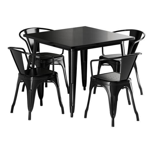 A Lancaster Table & Seating black metal table with four chairs.