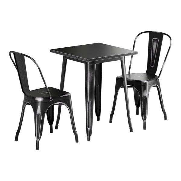 A Lancaster Table & Seating black metal table with two chairs.