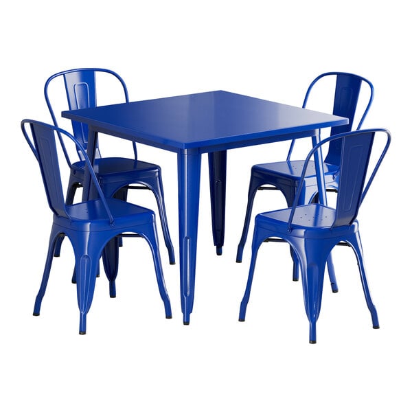 A blue rectangular Lancaster Table & Seating outdoor table with blue metal chairs.