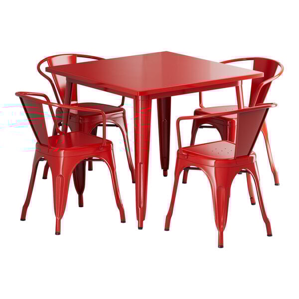 A red square Lancaster Table & Seating outdoor table with red metal legs and four red chairs.