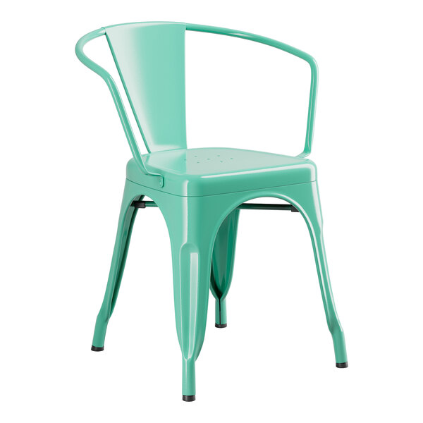 An aquamarine metal table with two arm chairs.