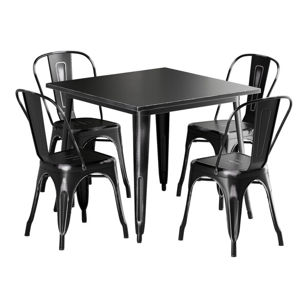 A Lancaster Table & Seating black metal table with four black chairs.