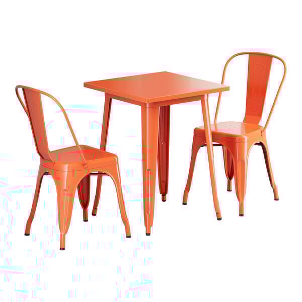 An orange metal Lancaster Table & Seating outdoor table and chairs set.