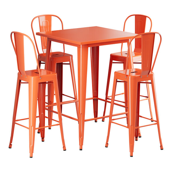 A Lancaster Table & Seating amber orange metal bar table with four chairs around it.