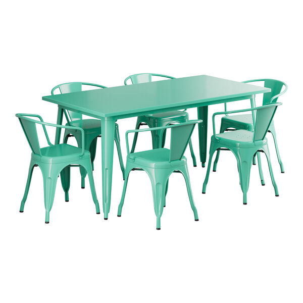 A green Lancaster Table and Seating outdoor table with chairs around it.
