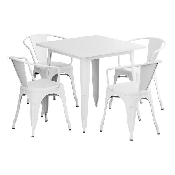 A white square table with four white chairs.