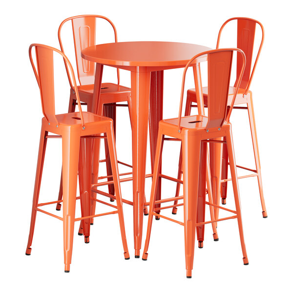 A Lancaster Table & Seating round orange metal bar table with four chairs.