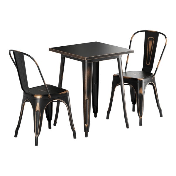 A black Lancaster Table & Seating outdoor table with two chairs.