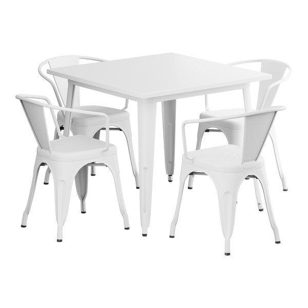 A Lancaster Table & Seating pearl white table with four arm chairs.