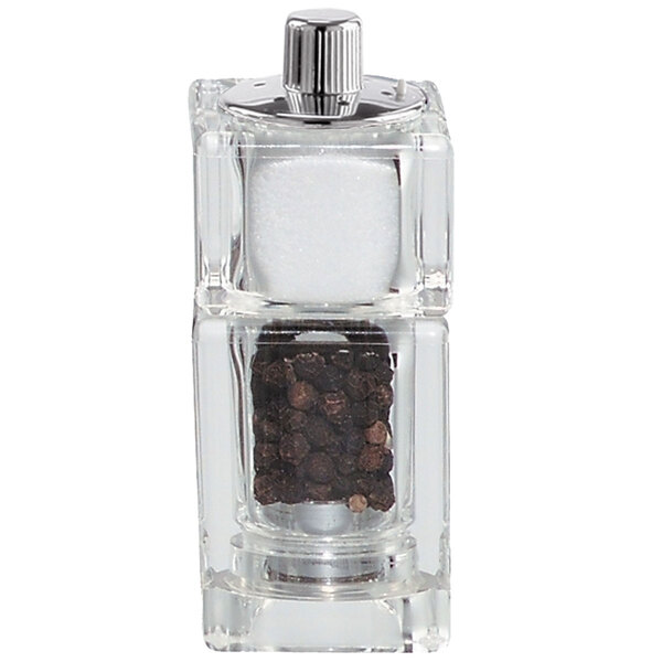 A Chef Specialties acrylic pepper mill with a black pepper and salt shaker.