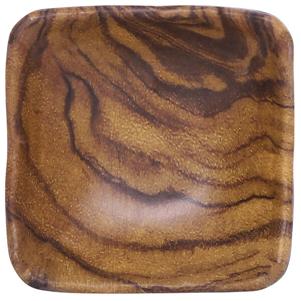 An Elite Global Solutions wood grain patterned square ramekin.