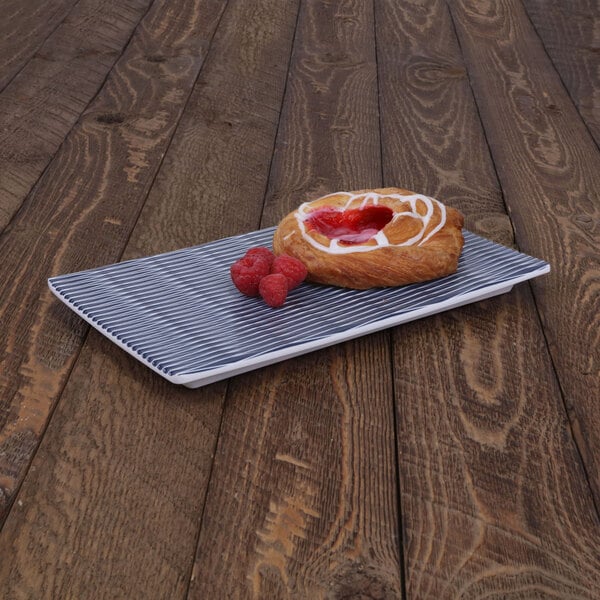 a pastry with raspberries on a plate