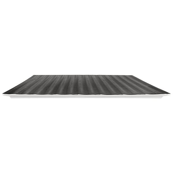A black textured Elite Global Solutions melamine platter on a table.