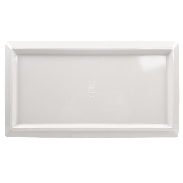 A white rectangular plate with a black textured surface and text reading "Elite Global Solutions"