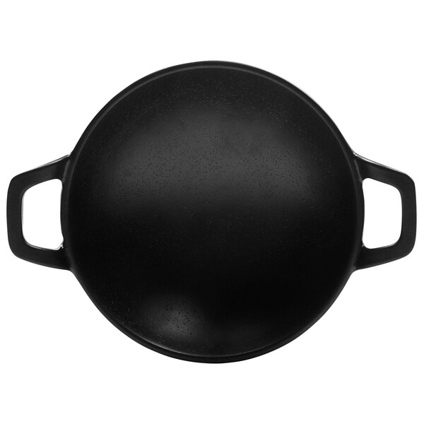 A black Elite Global Solutions faux cast iron wok with two handles.