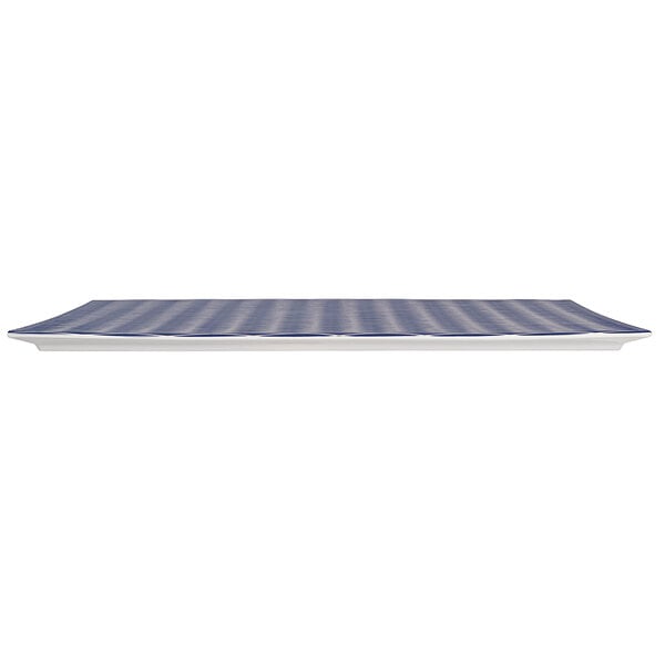 A blue rectangular melamine platter with a textured white and blue striped design.