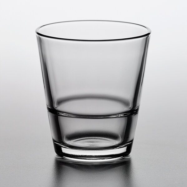 A Pasabahce stackable old fashioned glass on a white surface.