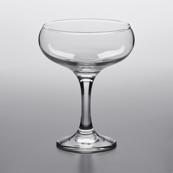 A Pasabahce clear wine glass with a stem.