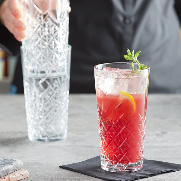 a glass with ice and a plant on it