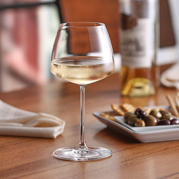 a glass of wine on a table