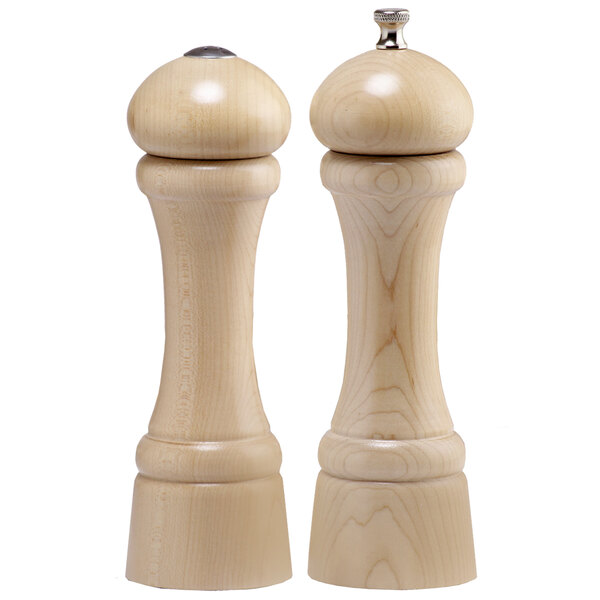 A close-up of a wooden Chef Specialties pepper mill and salt shaker with a metal top.
