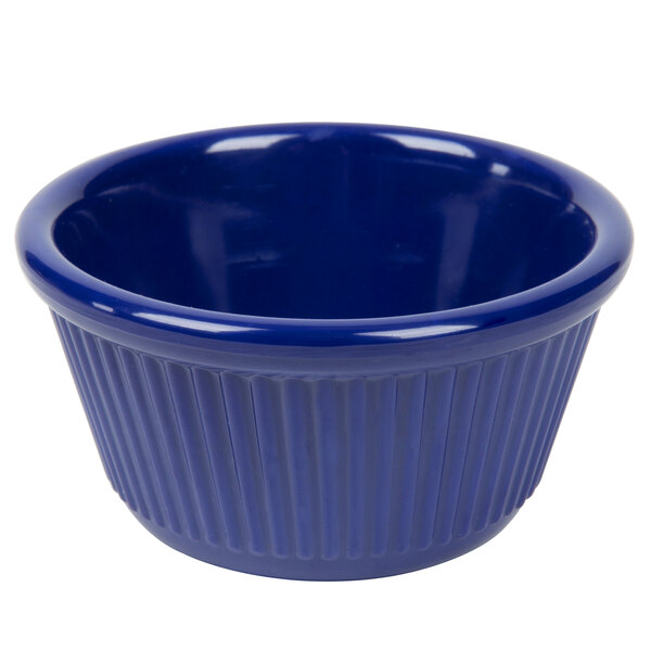 A navy blue fluted melamine ramekin.
