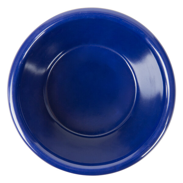 A navy blue fluted melamine ramekin.