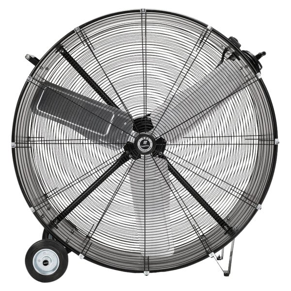 A large black TPI industrial drum fan on wheels.
