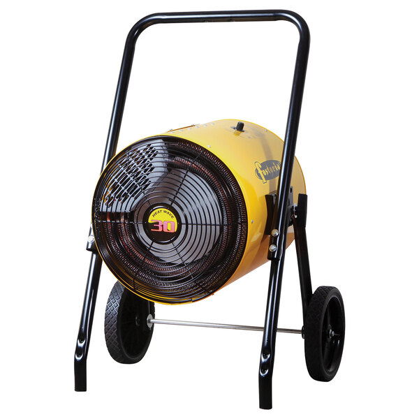 A yellow Fostoria portable electric salamander heater on a black cart.