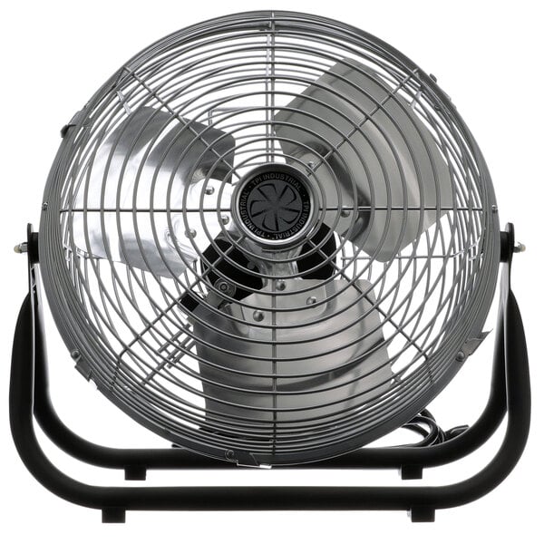 A TPI industrial floor fan with a black base.