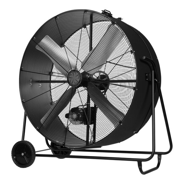 A large black TPI industrial drum fan on wheels.