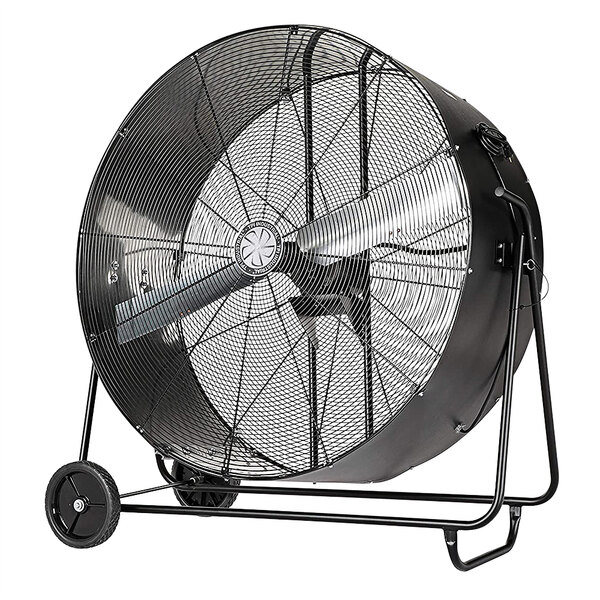 A large black TPI industrial fan with wheels.