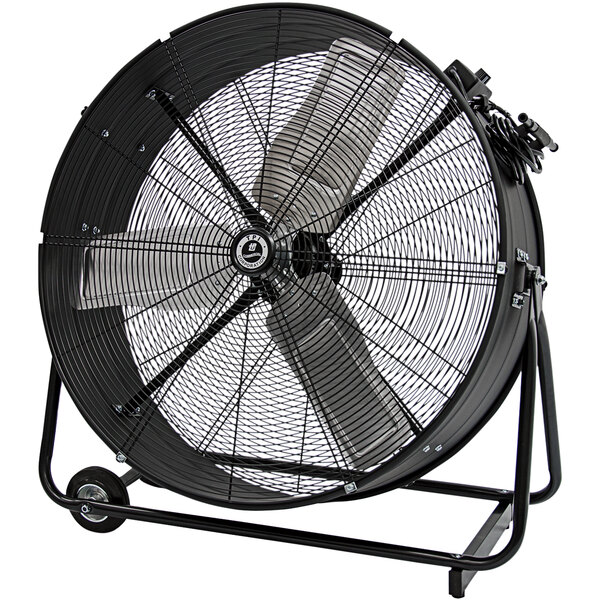 A large black TPI industrial drum fan with wheels.