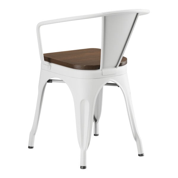 A white metal Lancaster Table & Seating chair with a walnut wood seat.