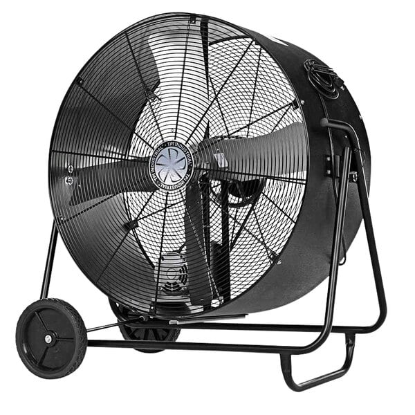 A large black TPI industrial drum fan on wheels.