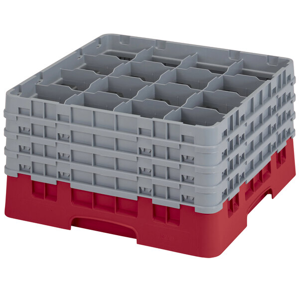A red and gray plastic Cambro glass rack with 16 compartments and 4 extenders.