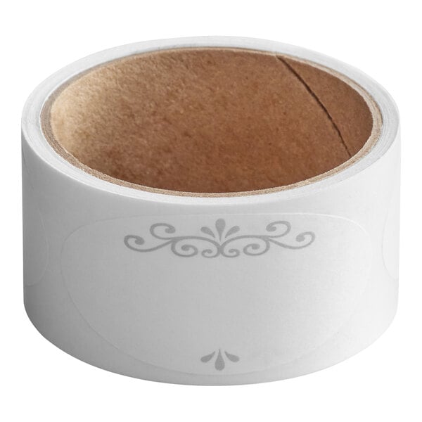 A roll of white oval labels with a decorative gray design, shown with a cardboard core.