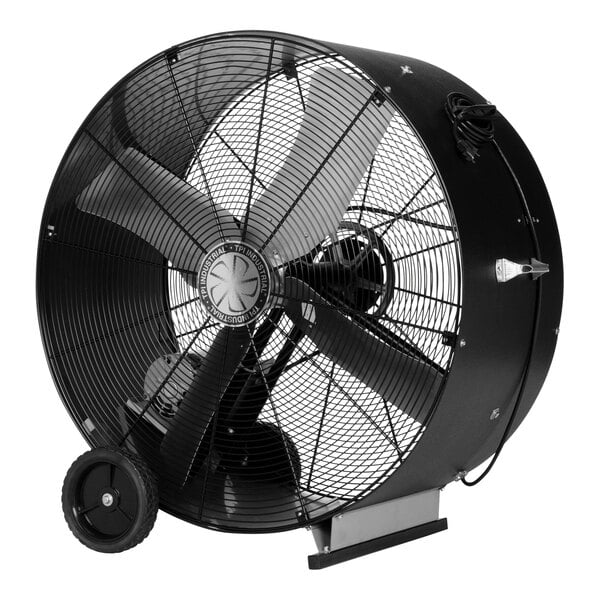 A large black TPI industrial drum fan with wheels.