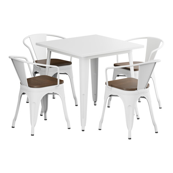 A white Lancaster Table & Seating square table with white metal chairs.