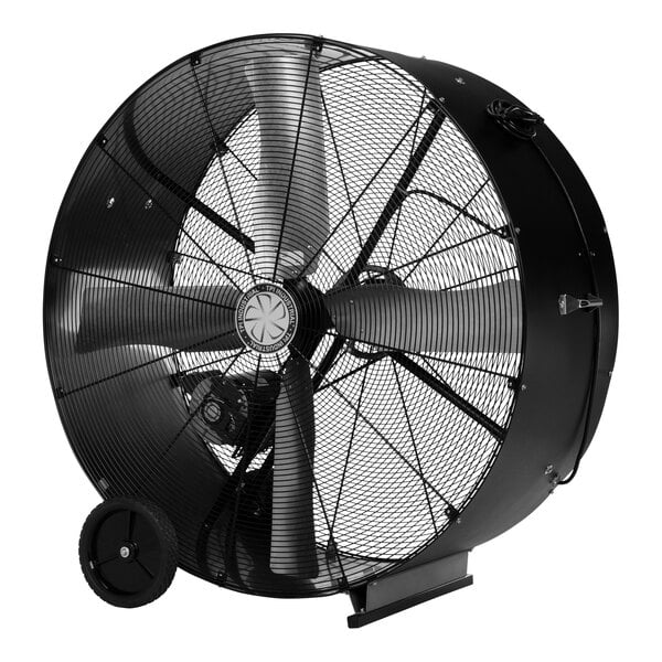 A large black TPI industrial drum fan with wheels.