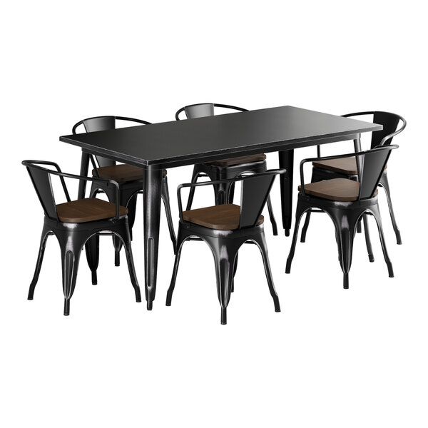 A Lancaster Table & Seating black metal table with walnut wood seats.