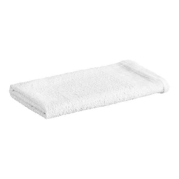 A folded white terry cloth towel is shown against a plain background.
